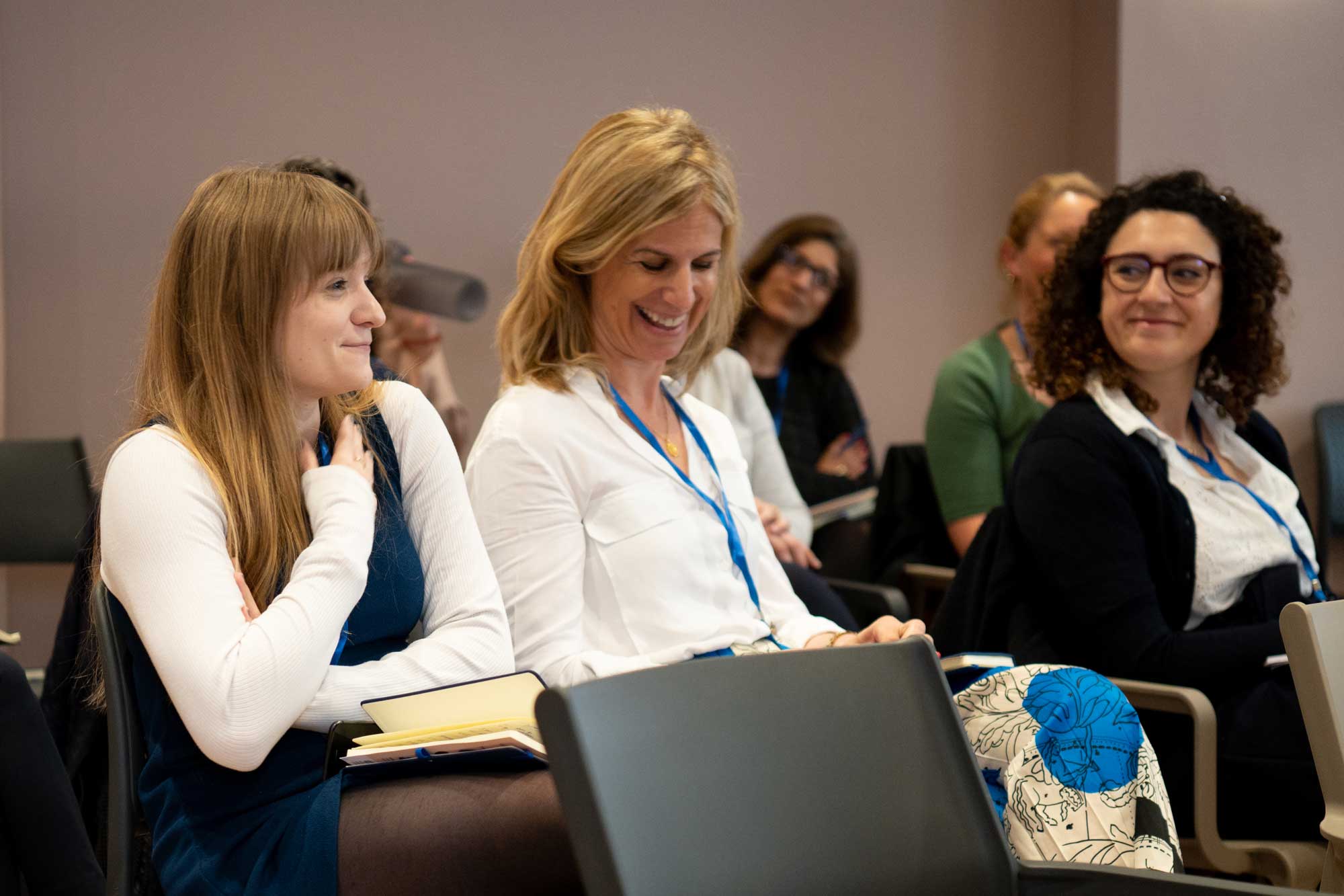 Smart About Health Employee smiling white on a lecture